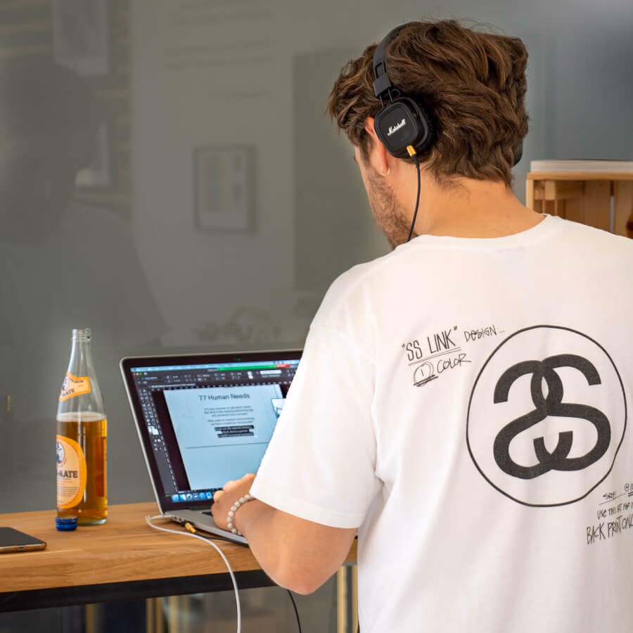 A person with back facing the camera and busy in productive work at Shed#2 Coworking